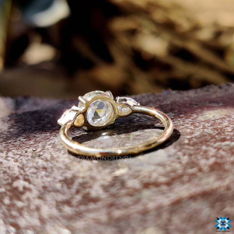Rose cut moissanite ring with prong setting in yellow gold.
