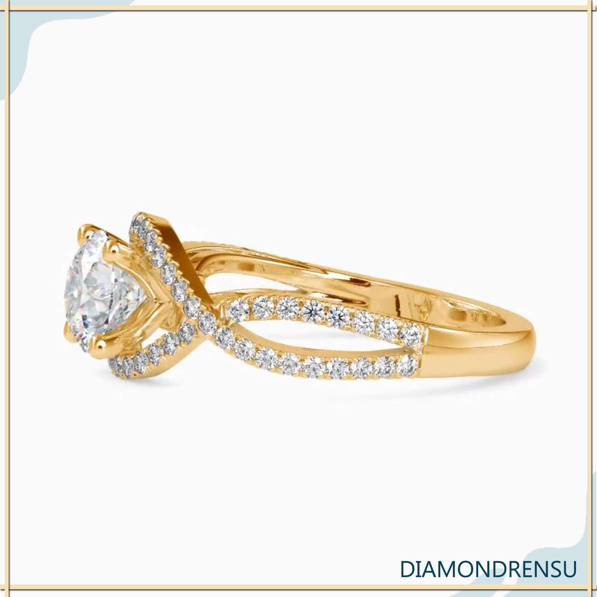  Diamondrensu engagement ring featuring a 2 carat round cut diamond in a twisted ring design.
