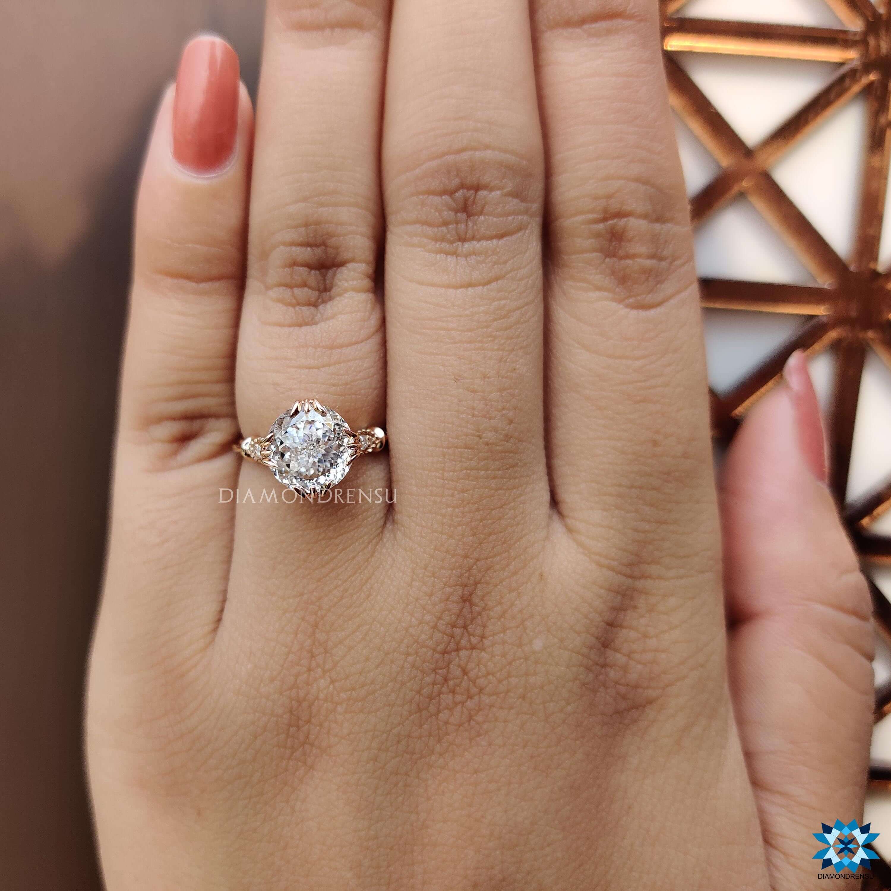 Rose gold moissanite ring with milgrain details.
