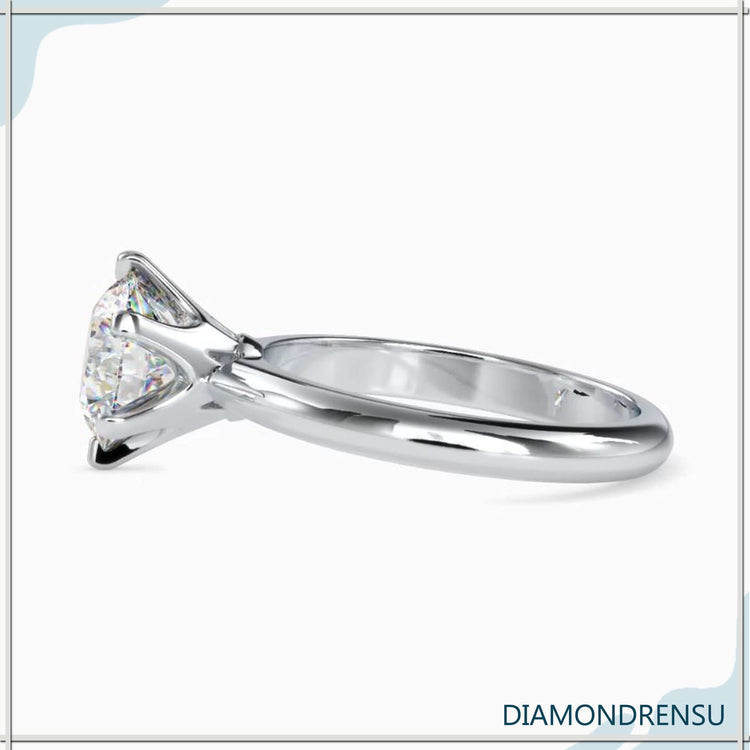 Yellow gold solitaire ring with 6 prong setting.
