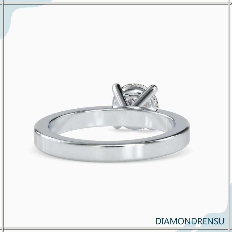 Handmade jewellery ring with round cut diamond solitaire.
