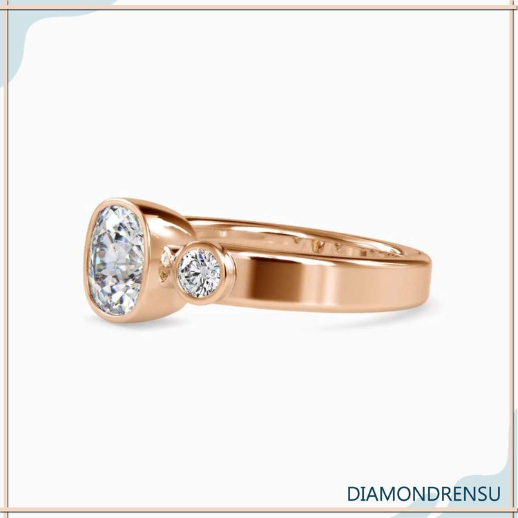 Yellow gold diamond ring with handmade bezel setting.
