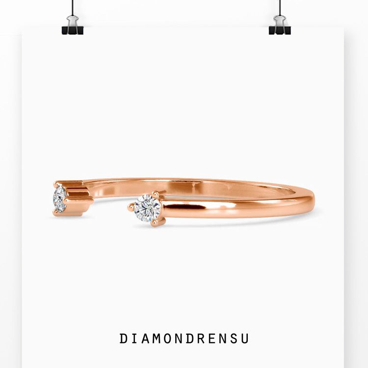Prong set wedding band with open centre in gold.
