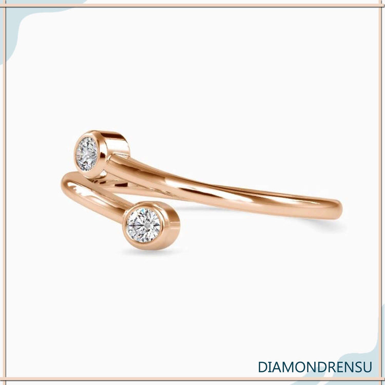 Round cut diamond wedding band with bypass design.
