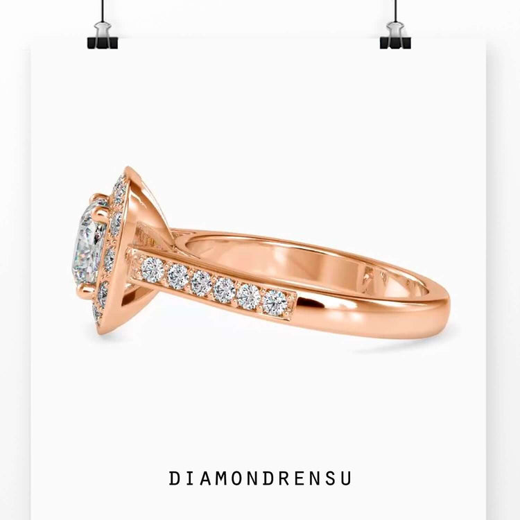 Cushion cut lab grown diamond set in halo with round prongs.
