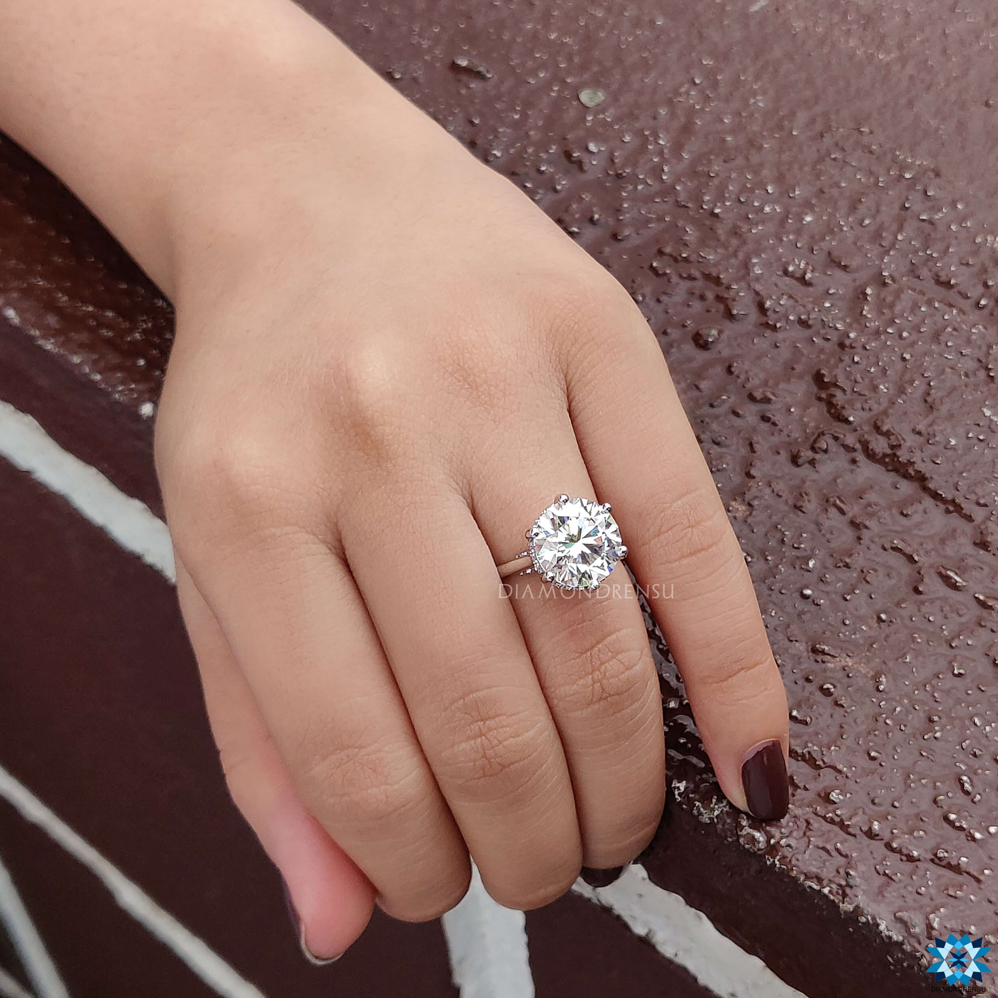 White gold moissanite ring with hidden halo moissanite stones and a dazzling finish.