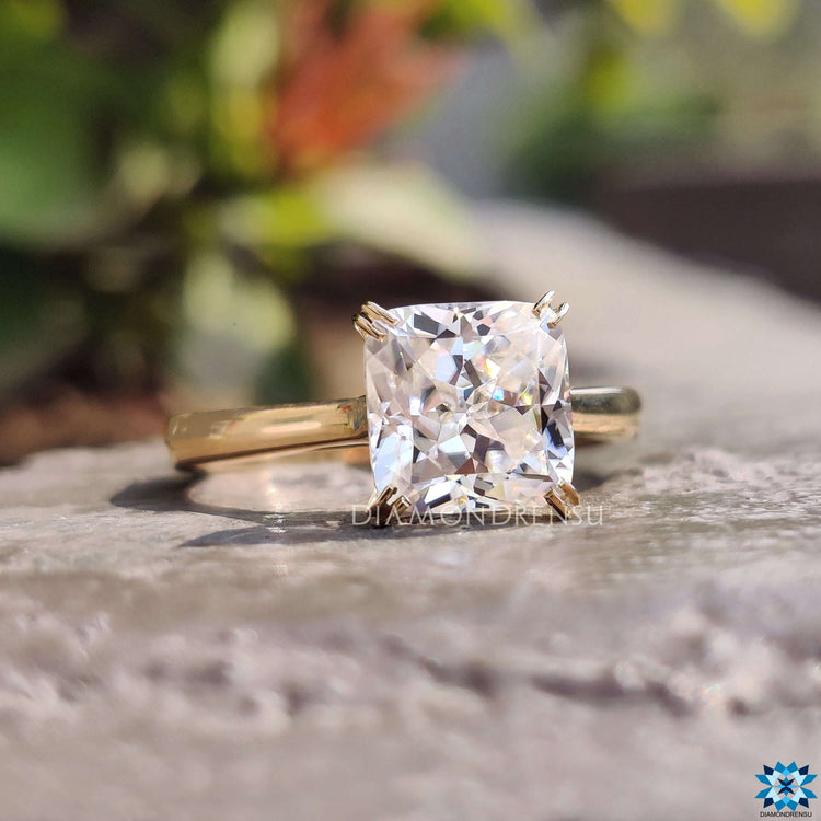 Hidden infinity style ring with cushion moissanite.
