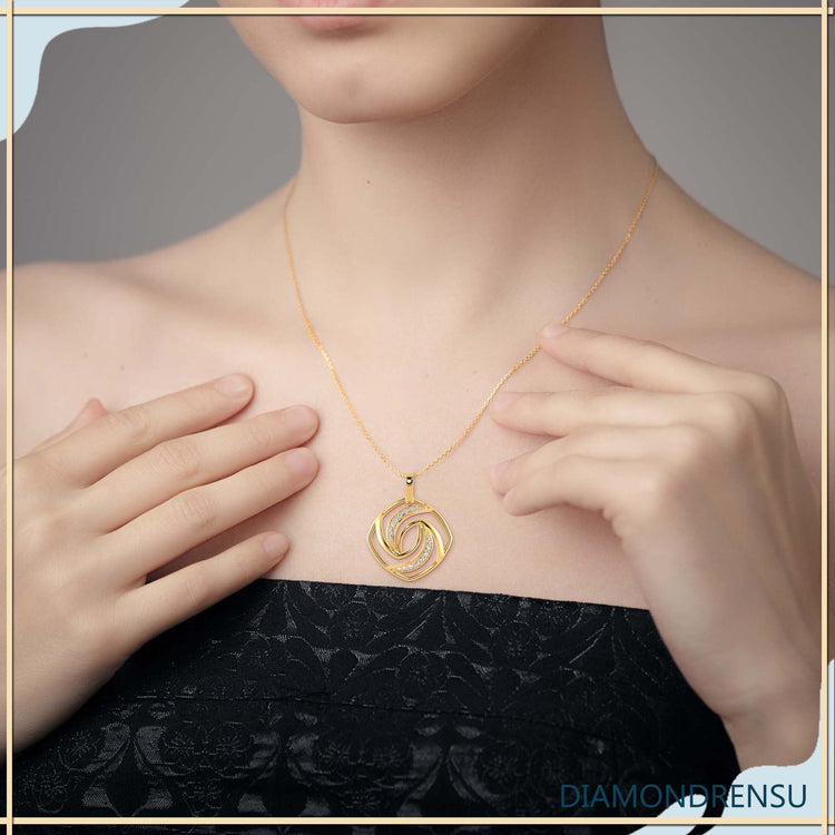 Spiral diamond pendant in rose gold, handmade in the UK.
