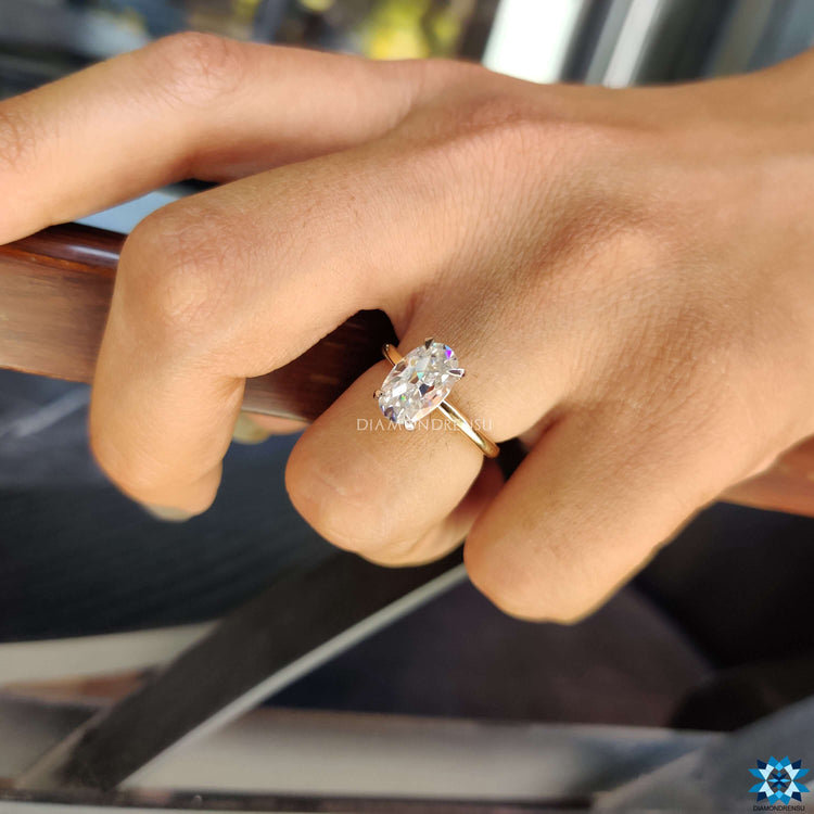 Solitaire ring with four prong Moval cut moissanite.
